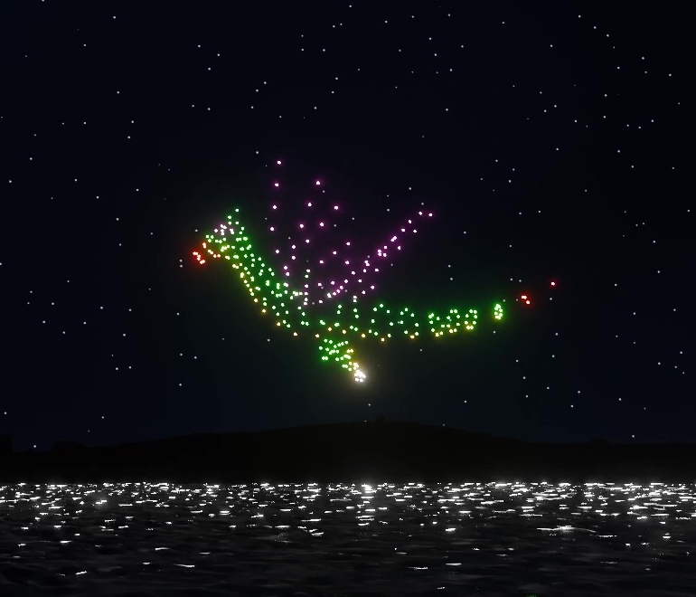 Un dragon survole le ciel lors d'un spectacle de drones lumineux - Alpha Drones France